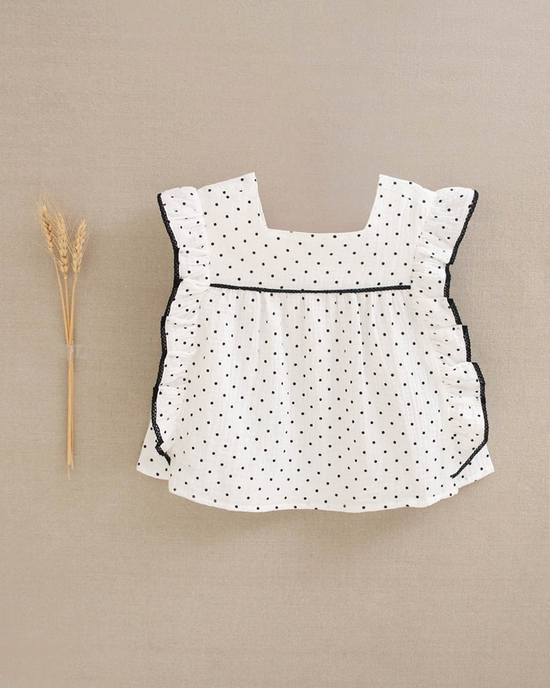 Blusa de niña blanca con topitos y contraste en negro