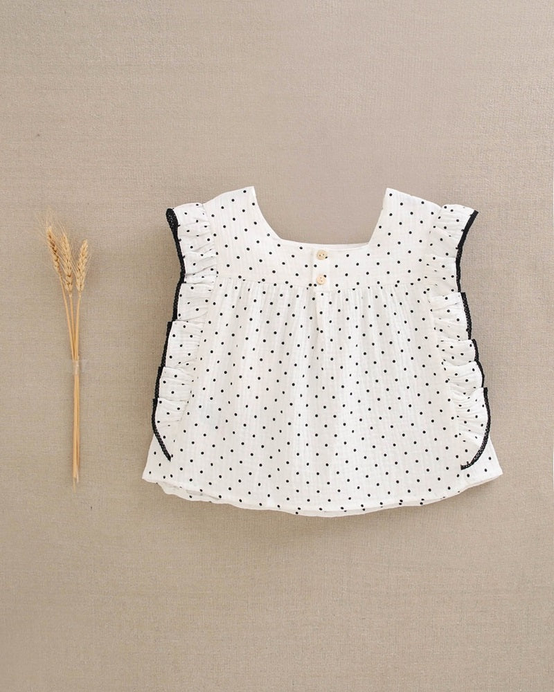 Blusa de niña blanca con topitos y contraste en negro
