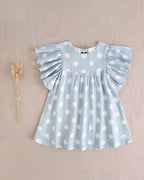 Vestido de niña azul cielo con lunares blancos y lazo