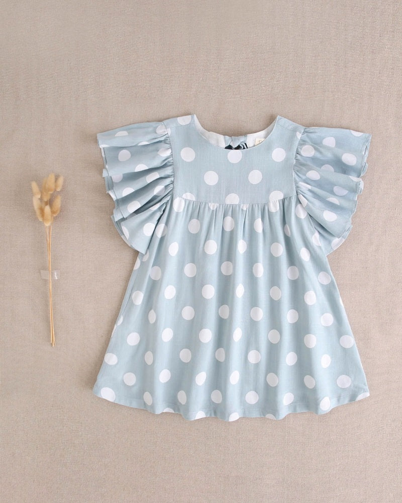 Vestido de niña azul cielo con lunares blancos y lazo