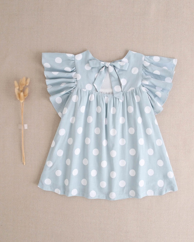 Vestido de niña azul cielo con lunares blancos y lazo