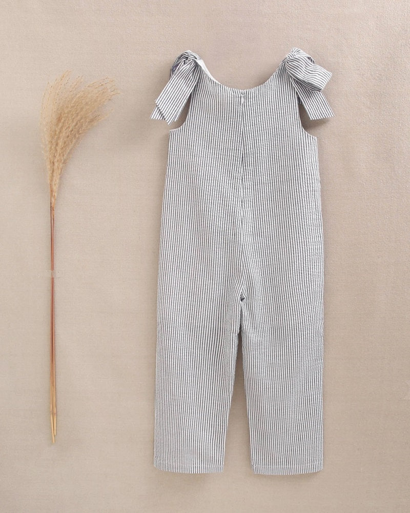 Mono de niña de rayas con lazadas en los hombros