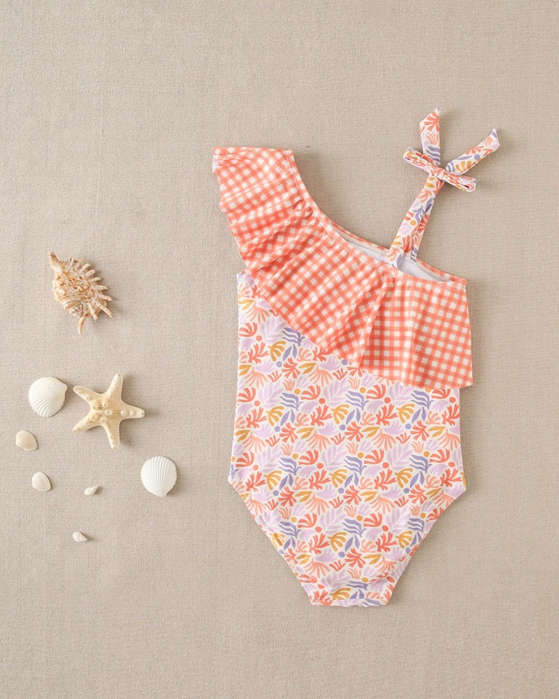 Bañador de niña con estampado floral y volante vichy naranja