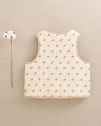 Chaleco de niña beige flores